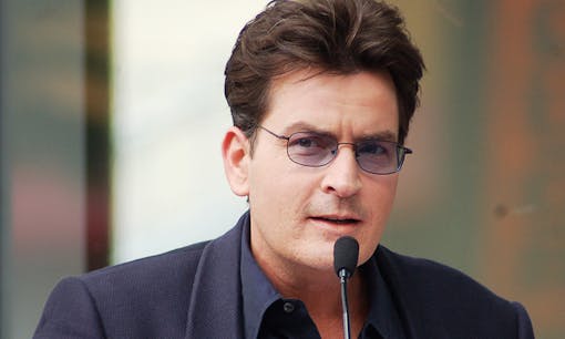 Charlie Sheen with microphone at press conference