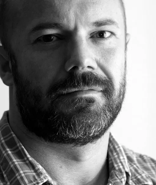 Black and white headshot of Andrew Sullivan