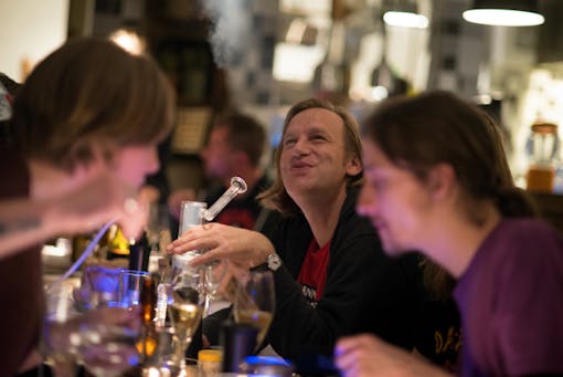 Vaping and smiling at the Green House Kitchen's "Vape & Dine" concept meal in Amsterdam