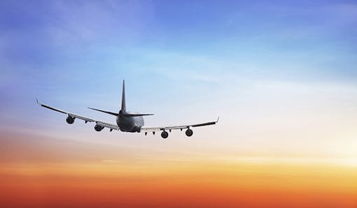 Plane flying through the sky