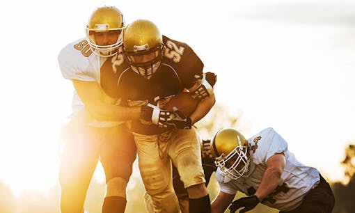 Football players at sunset