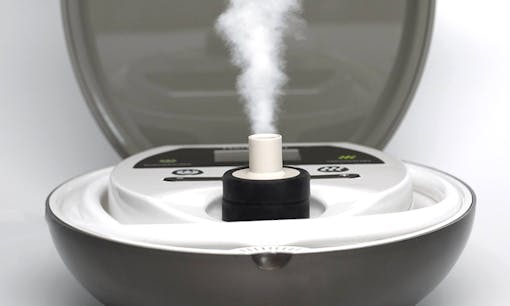 Herbalizer table-top vaporizer emitting vapor