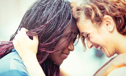 Lesbian couple embracing tenderly