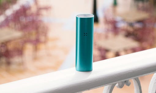Teal PAX 2 Vaporizer on patio