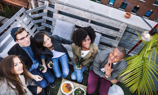 Friends hanging out on rooftop patio