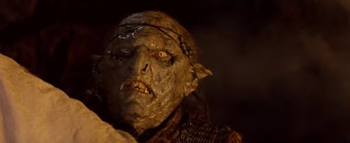 Orc watching an Uruk-hai get birthed in The Fellowship of the Rings