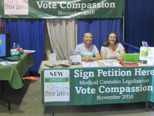 New Approach South Dakota cannabis activists at their booth