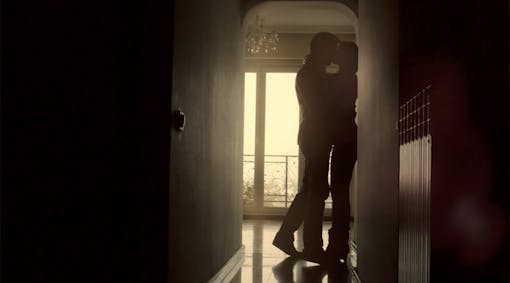 A couple making out in a room