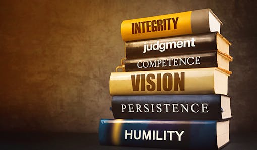 Stack of books with leadership qualities