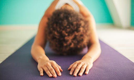 Woman doing yoga in studio