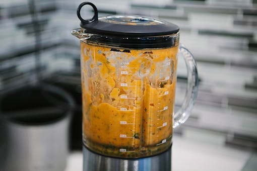 Making a raw cannabis, sweet potato, and pear smoothie