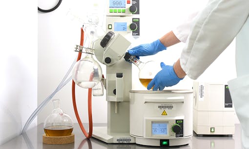 A medical worker using cannabis extraction equipment in the Tilray lab