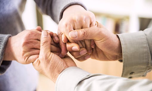 Couple embracing each other's hands