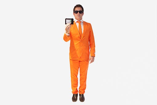 Man dressed up in an orange suit pretending to be a secret agent