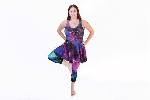 Woman wearing "Northern Lights" galaxy leggings and dress