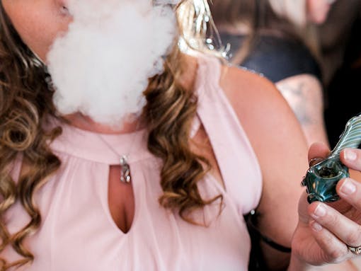 A wedding guest enjoying the venue's "weed bar"