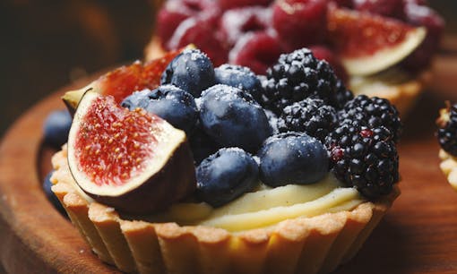 Sweet berries and fruit on top of a sweet tart