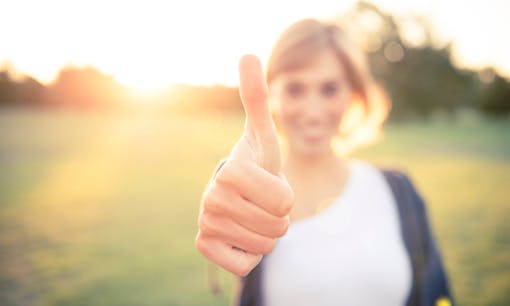 Woman with thumbs up