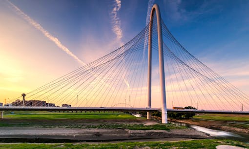 Bridge outside of Dallas, Texas overlooking farm at sunset