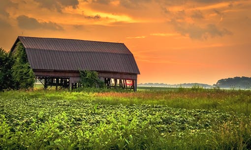 Midwest farm at sunset in Oklahoma