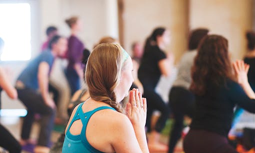 Woman doing yoga at yoga studio