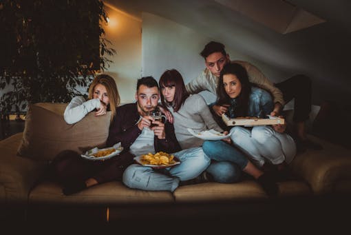 Group of happy friends bonding at home - Young adults having party and doing various activities