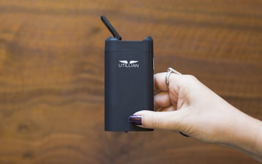Holding the Utillian 720 portable vaporizer