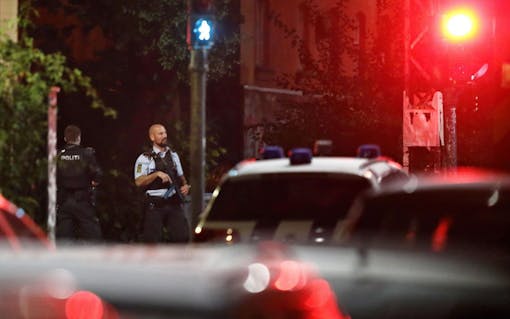 Danish police officer on patrol near Christiania in Copenhagen, Denmark, late night Wednesday, Aug. 31, 2016. Police say they have shot and critically wounded an armed Danish man following an earlier Copenhagen shootout that left two officers and a bystander wounded. (Jens Dresling/ Polfoto via AP)