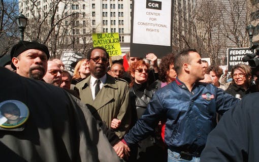 Actor Susan Sarandon, center, takes part in a protest at New York's police headquarters Thursday, March 25, 1999. Sarandon was among 219 people arrested for blocking the entrances to police headquarters, the largest group so far in a string of daily protests against the police killing of an unarmed African immigrant. (Mitch Jacobson/AP)