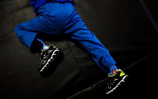Bruno Stillo shuffles along the floor as he exercises his crawling during a therapy session at B&V Thera-Pro in Miami, FL on Friday, October 28, 2016. Before he began using medical marijuana, Bruno was mostly immobile. Since he started integrating it into his daily medication, his motor skills have improved and his epileptic seizures have drastically decreased. By Scott McIntyre