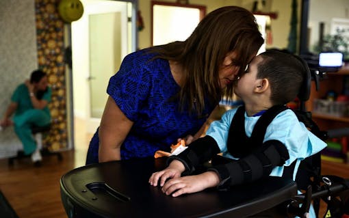 In between therapy sessions, Jacel Delgadillo shares a moment with her son Bruno Stillo in Miami, FL on Friday, October 28, 2016. Stillo suffers from Dravet syndrome, a rare and catastrophic form of intractable epilepsy that begins in infancy. At one time, he would experience 300 seizures a day. In 2014, Delgadillo began using cannabis oil for her son's seizures and has gone from mostly immobile and non-responsive to being able to crawl and respond to his surroundings. "We love to see how much he’s grown and how much he’s learned," said Delgadillo. By Scott McIntyre