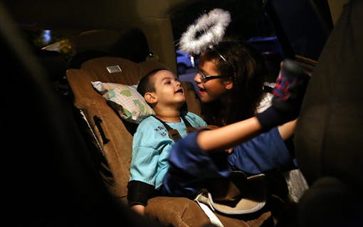 Angelene Stillo plays with her brother Bruno in Miami, FL on Friday, October 28, 2016. Before he started using medical marijuana, Bruno did not act aware of the people in his life. "We love to see how much he's grown and learned," said Jacel Delgadillo. (Scott McIntyre for Leafly)