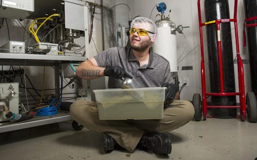 Extraction tech Chris Moder poses for a portrait Friday, Dec. 30 2016 at Dixie Elixirs in Denver, CO. He has worked for the company for six years and uses a "super critical CO2" method to separate cannabinoids. Moder explains the method is a clean, well-tested extraction process to obtain pure THC. "It's what gives it power," he said. "I used air to make that, high five!"