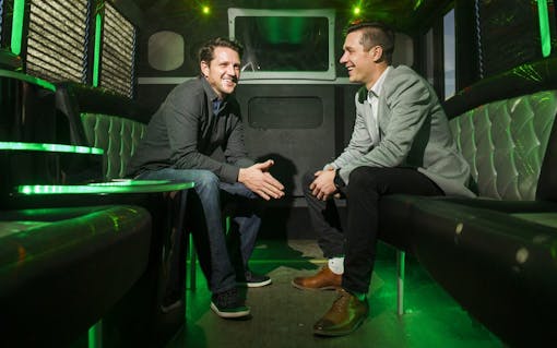 My 420 Tours CEO JJ Walker, left, and COO Danny Schaefer pose for a picture Thursday, Dec. 29 2016 on a transportation bus outside their office at 3881 Steele St #10 in Denver, CO. The two started operating a cannabism tourism experience in April 2013. Tours involve visits to grow houses, dispensaries, or a sushi, sake and joint rolling class. (Daniel Brenner for Leafly)