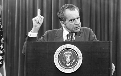 PRESIDENT PODIUM WATERGATE SCANDAL AFTERMATH PODIUM SEAL EMPHASIS SPEAKING GESTURING INDEX FINGER