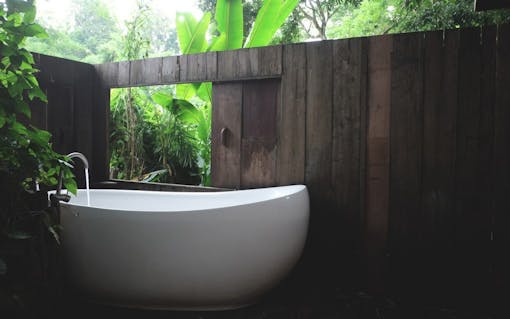 white bathtub in outdoor bath