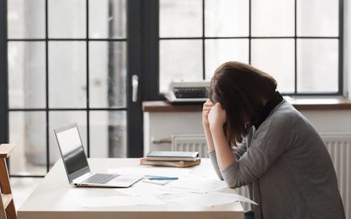Tired business woman at workplace in office