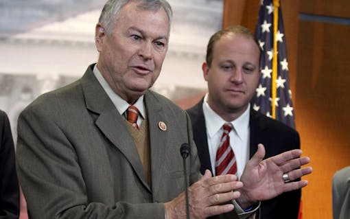 Rep. Dana Rohrabacher, R-Calif., left, accompanied by Rep. Jared Polis, D-Colo.(AP Photo/Lauren Victoria Burke)