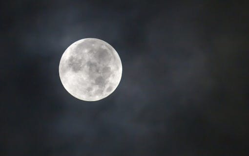 Close up of full moon in cloud