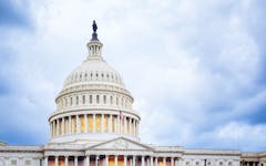 the dome of the US Capitol seen on a cloudy day