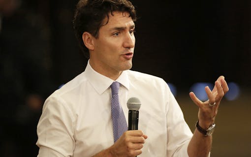 Canada's Prime Minister Justin Trudeau answers questions from students at Havana University in Havana, Cuba, Wednesday, Nov. 16, 2016. Trudeau is on an official visit to Cuba. (Enrique De La Osa, Pool photo via AP)