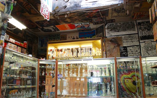 The interior is a treasure trove of glass products, rock 'n roll memorabilia, and pop culture artifacts.