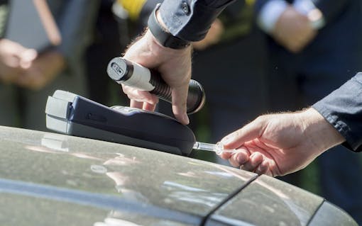 Sacramento Police officer Luke Moseley conducts simulated saliva field sobriety test on Jaimi Kenyon, a CHP Sergent as members of the Highway Patrol and Sacramento Police Department simulate traffic stops involving drivers suspected of being under the influence of drugs and alcohol at the California State Capitol, Wednesday May 10, 2017. The demonstration will showed the current procedures used by law enforcement officers as well as new roadside drug testing technology that could be used in the future. Photo by photo by Brian Baer