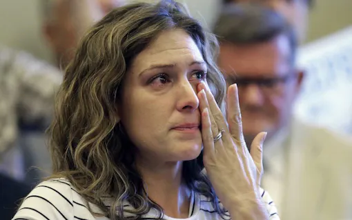 Desiree Hennessy cries during the Utah Patients Coalition news conference at the Utah State Capitol Monday, June 26, 2017, in Salt Lake City. A group of activists and Utah residents with chronic conditions has launched a ballot initiative to ask voters next year to pass a broad medical marijuana law. Her adopted son Hestevan has cerebral palsy and suffers from chronic nerve pain, seizure disorder, and life-threatening complications from his medication. (Rick Bowmer/AP)