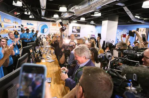 State Sen. Tick Segerblom, Nevada's legalization champion, inspects his purchase a few minutes past midnight. (Ronda Churchill for Leafly)