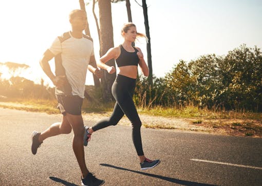 Shot of a fit young couple going for a run outdoors