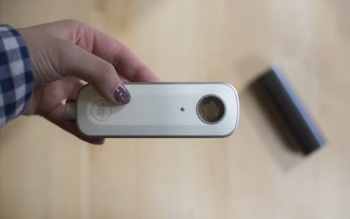 Firefly 2 portable vaporizer with the Pax 3 in the background