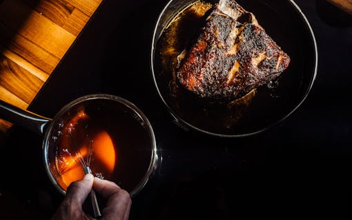 Roasted pork rests and cools prior to being coated in Lemon Haze barbecue sauce.