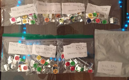 Samples of cannabis product with a judge's notes for a cannabis competition