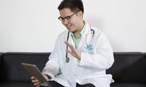 Dr. David Nguyen greeting a medical marijuana patient at a telemedicine appointment
